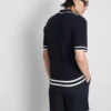El polo con cremallera texturizada de The Edit