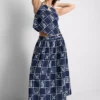 Falda midi de algodón bordada con corte en A