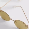 Gafas de sol redondas con detalle floral