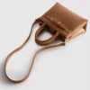 Mini bolso con detalle de hebilla
