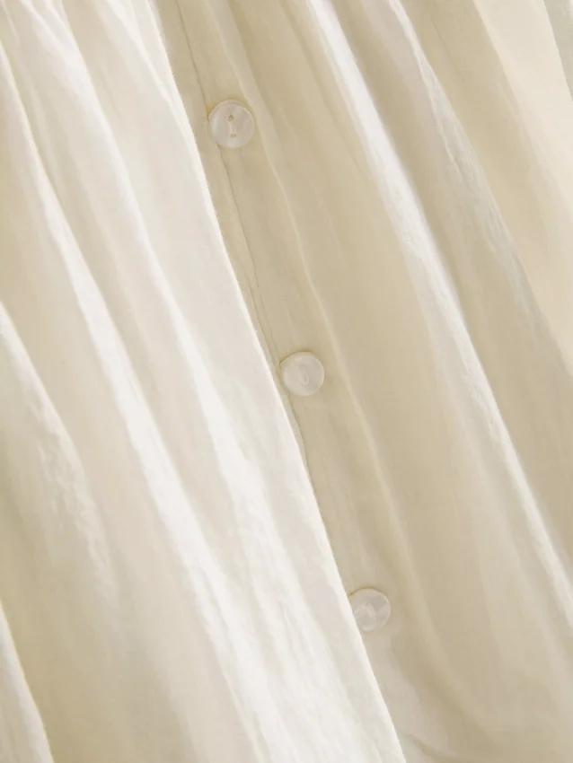 Mini vestido con volantes y ribete de encaje de Paula Echevarría