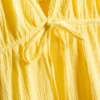 Mini vestido de algodón con cuello en V y volantes