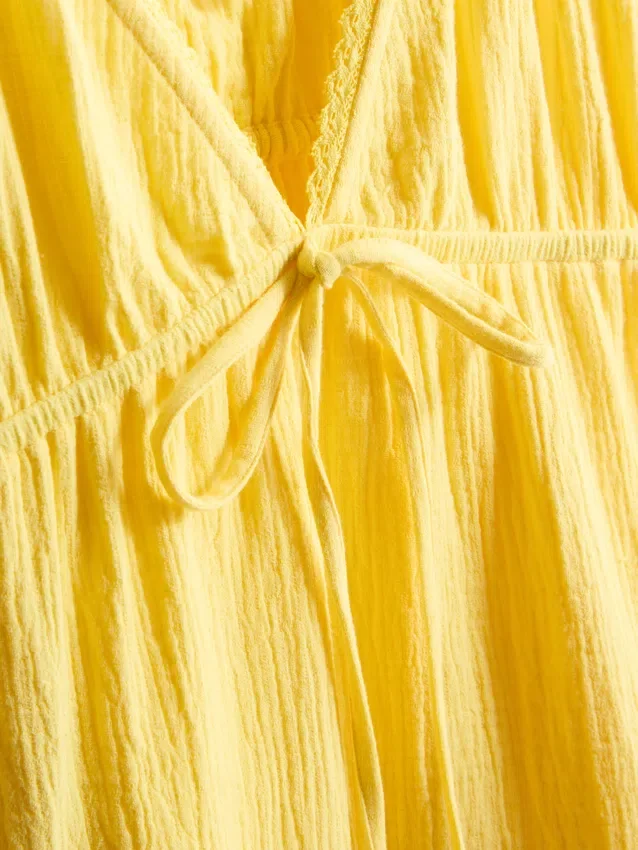 Mini vestido de algodón con cuello en V y volantes