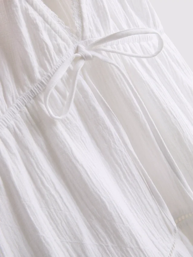 Mini vestido de algodón con cuello en V y volantes