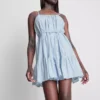 Mini vestido de popelín con volantes y tirantes