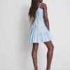 Mini vestido de popelín con volantes y tirantes