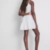 Mini vestido de popelín con volantes y tirantes