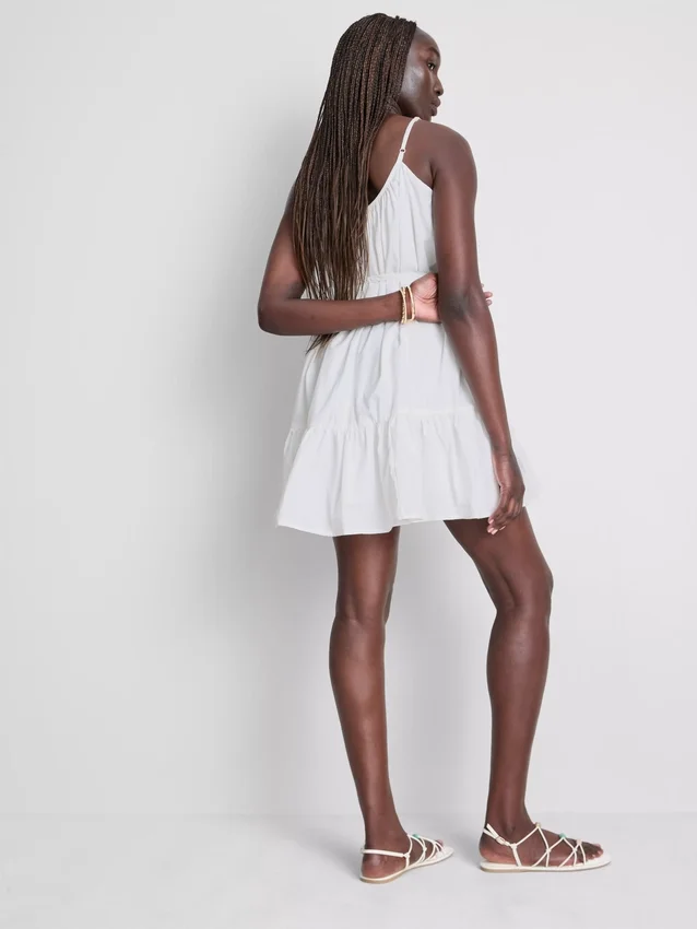 Mini vestido de popelín con volantes y tirantes