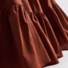 Mini vestido de popelín con volantes y tirantes