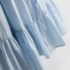 Mini vestido de popelín con volantes y tirantes
