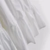 Mini vestido de popelín con volantes y tirantes