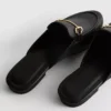 Mules tipo mocasín de imitación de cuero con detalle de bocado de montura
