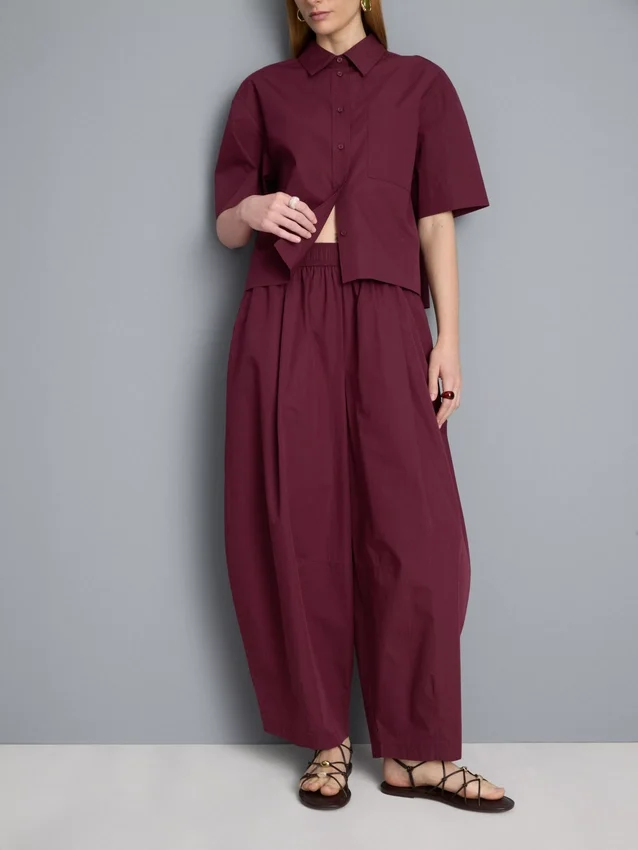 Pantalones acampanados plisados con tacto de papel