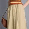 Pantalones acampanados plisados con tacto de papel