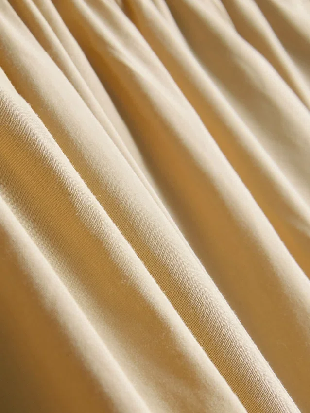 Pantalones acampanados plisados con tacto de papel