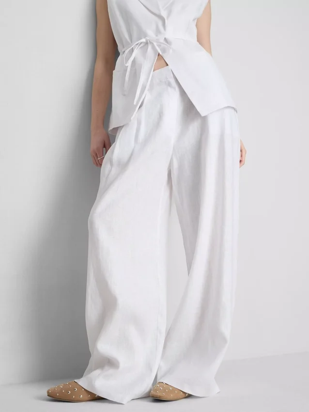 Pantalones anchos de lino plisados de The Edit
