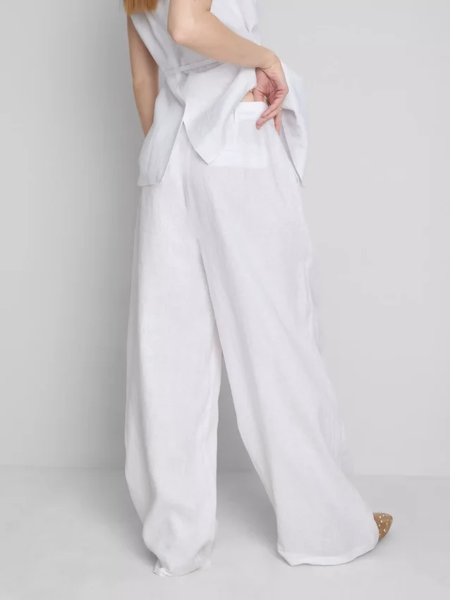 Pantalones anchos de lino plisados de The Edit