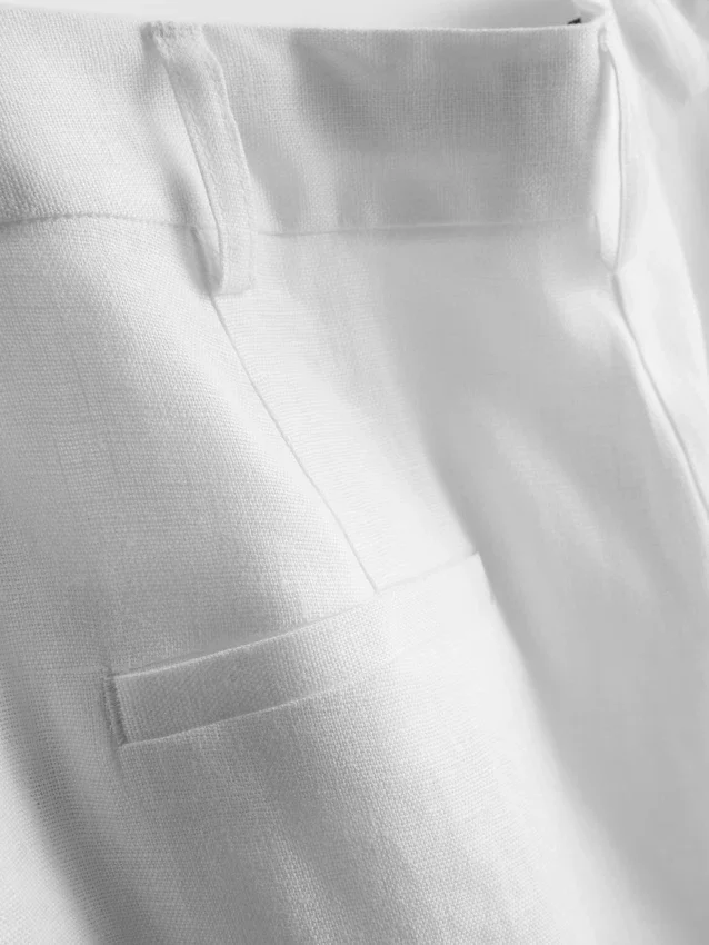 Pantalones anchos de lino plisados de The Edit