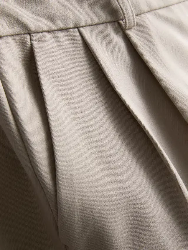 Pantalones anchos plisados