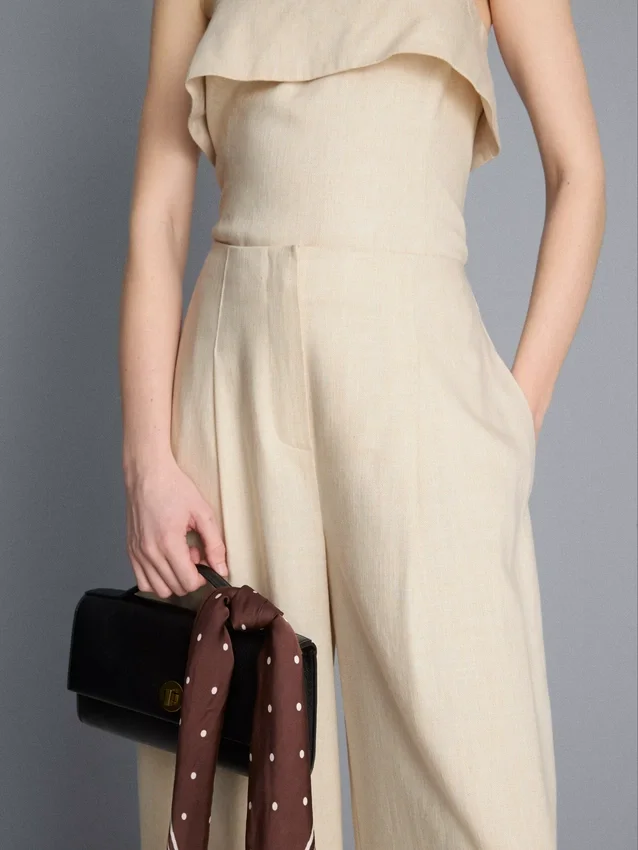 Pantalones anchos plisados con textura