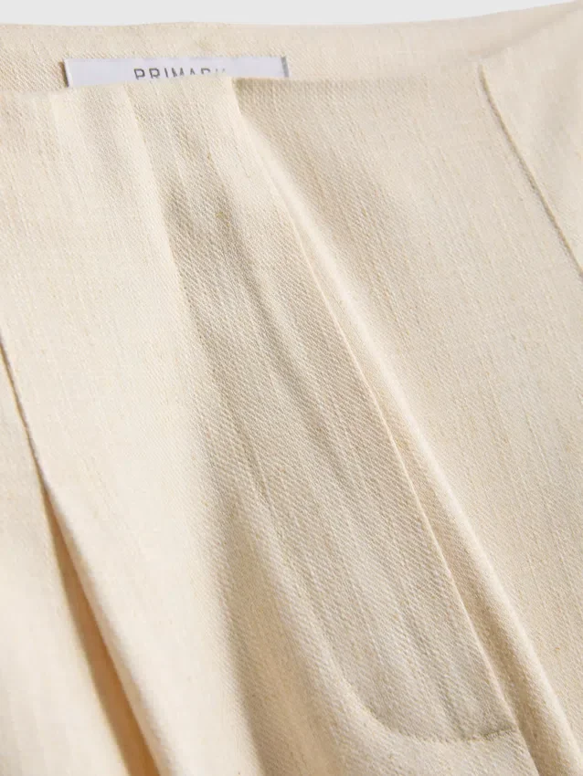 Pantalones anchos plisados con textura