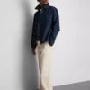 Pantalones chinos holgados de talle medio
