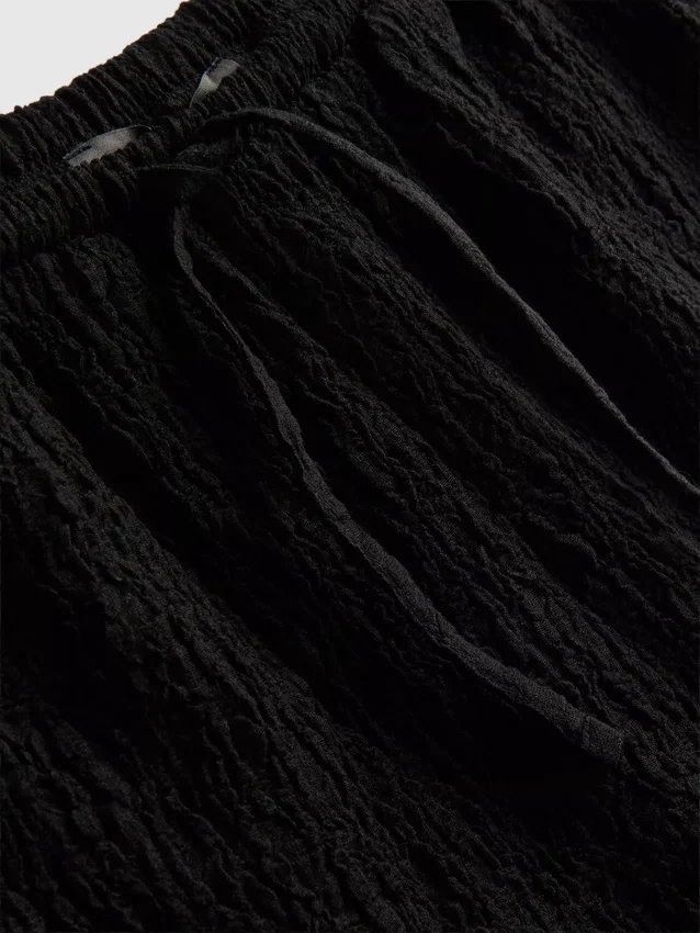 Pantalones cortos arrugados con cordón