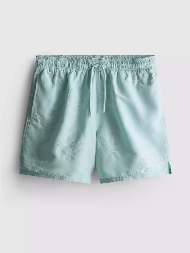 Pantalones cortos con hojas bordadas