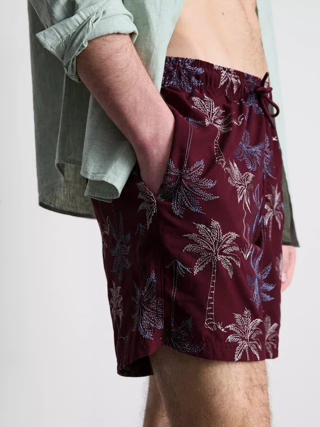 Pantalones cortos con palmeras bordadas