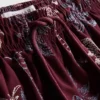 Pantalones cortos con palmeras bordadas