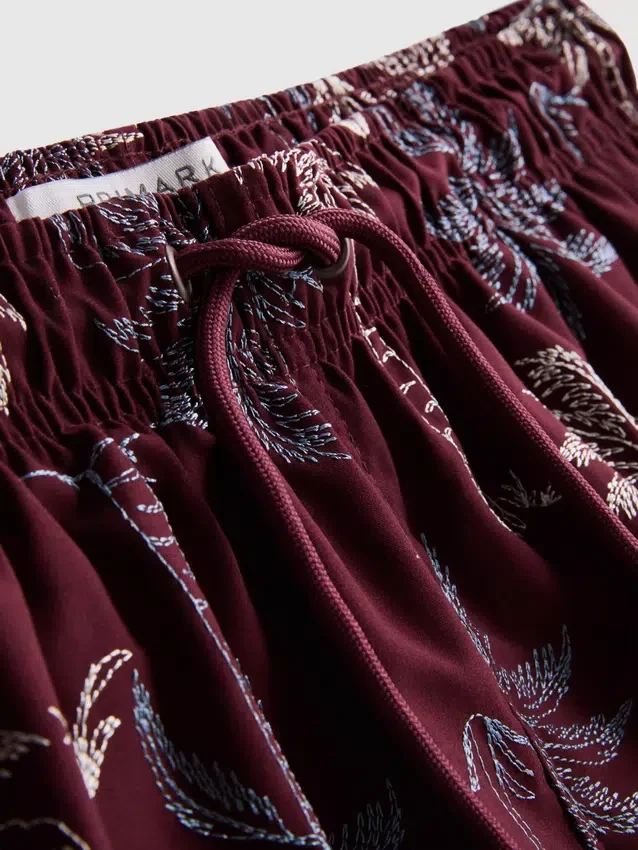Pantalones cortos con palmeras bordadas