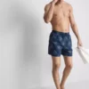 Pantalones cortos con sol bordado