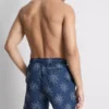 Pantalones cortos con sol bordado