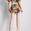 Pantalones cortos con volantes y estampado tropical
