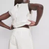 Pantalones cortos de algodón bordados con bordes festoneados