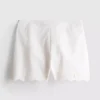 Pantalones cortos de algodón bordados con bordes festoneados