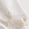 Pantalones cortos de algodón bordados con bordes festoneados