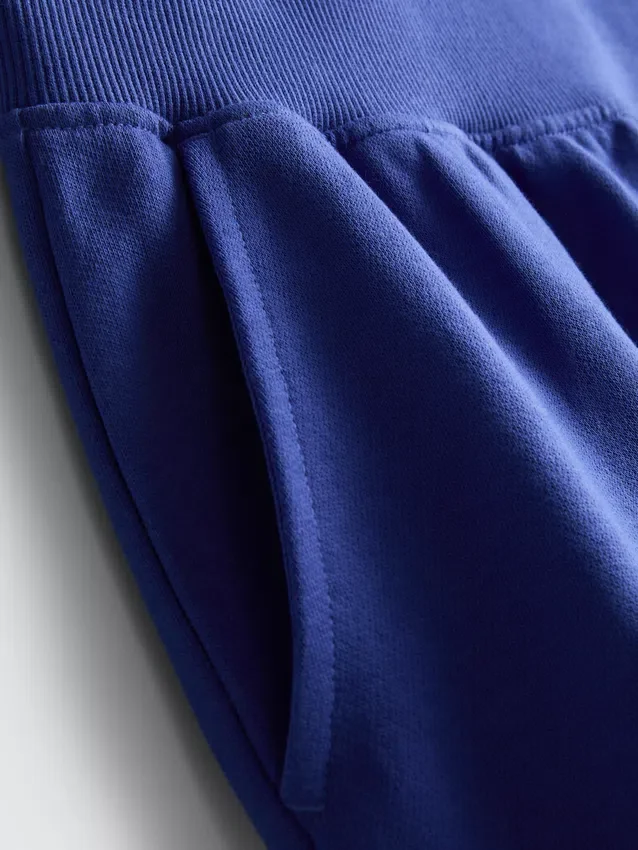 Pantalones cortos de algodón con dobladillo abierto