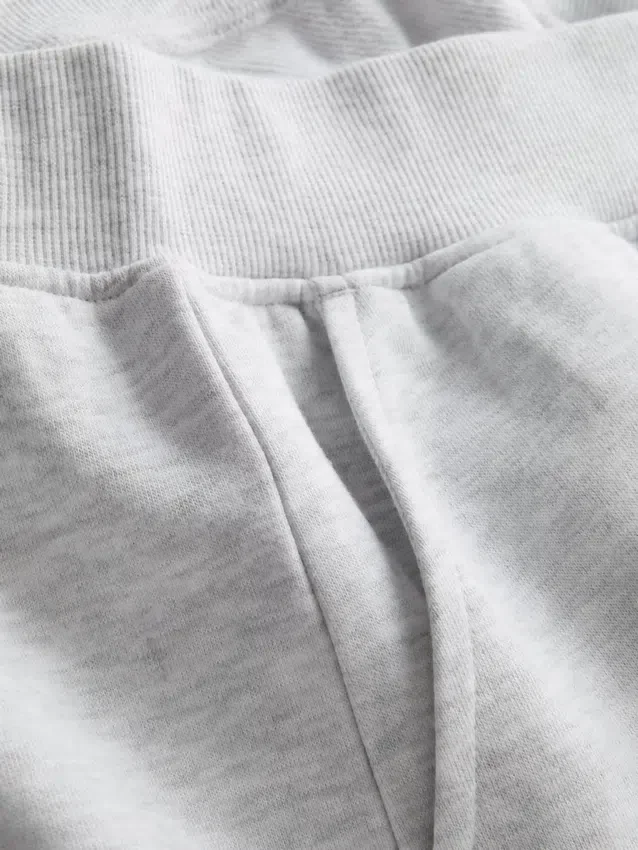 Pantalones cortos de algodón con dobladillo abierto