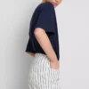 Pantalones cortos de mezclilla de talle medio con dobladillo