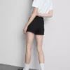 Pantalones cortos de mezclilla de talle medio con dobladillo