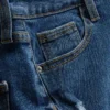 Pantalones cortos de mezclilla de talle medio con dobladillo