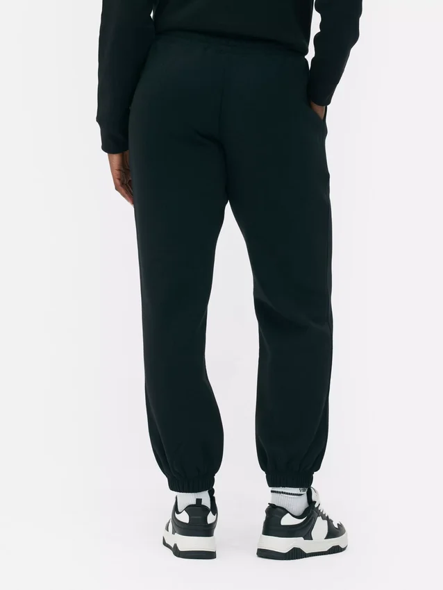 Pantalones de chándal con cordón y puños en las perneras