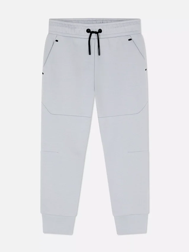 Pantalones de chándal con puños y ribete