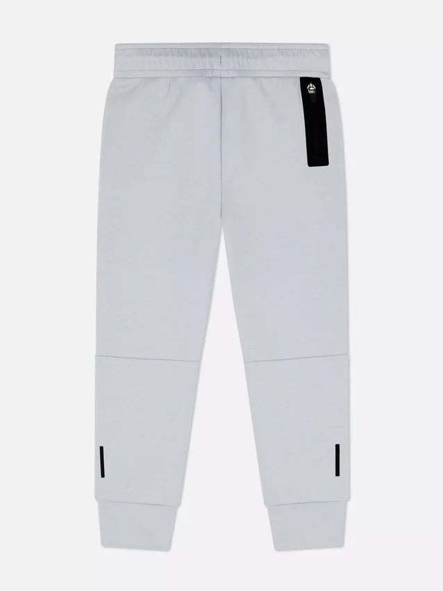 Pantalones de chándal con puños y ribete
