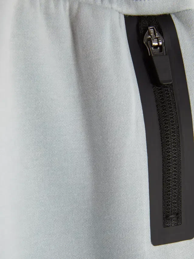 Pantalones de chándal con puños y ribete