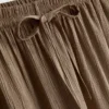 Pantalones de pierna ancha con textura arrugada