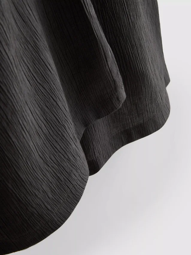 Pantalones de pierna ancha con textura arrugada