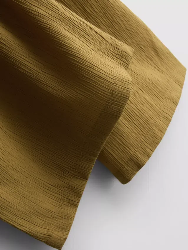 Pantalones de pierna ancha con textura arrugada