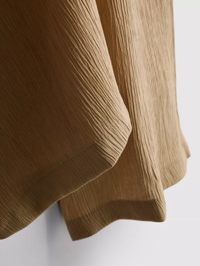 Pantalones de pierna ancha con textura arrugada